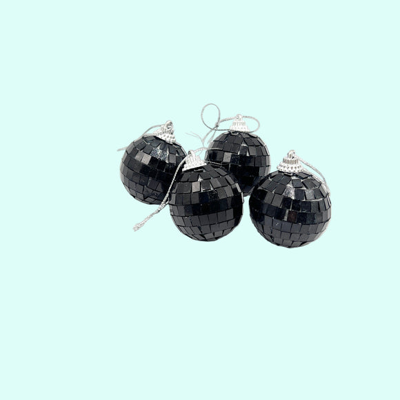 Black disco ball ornaments on a light blue background