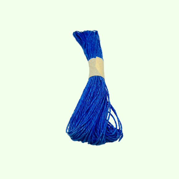 Blue thread bundle with a white label on a light gray background