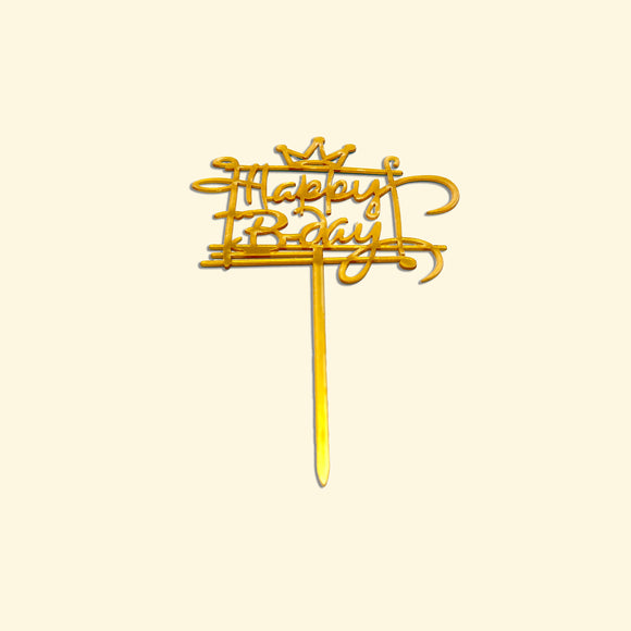 Gold 'Happy Birthday' cake topper on a beige background