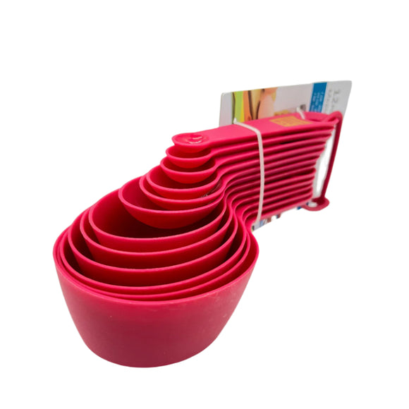 Set of Pink measuring cups with a white background