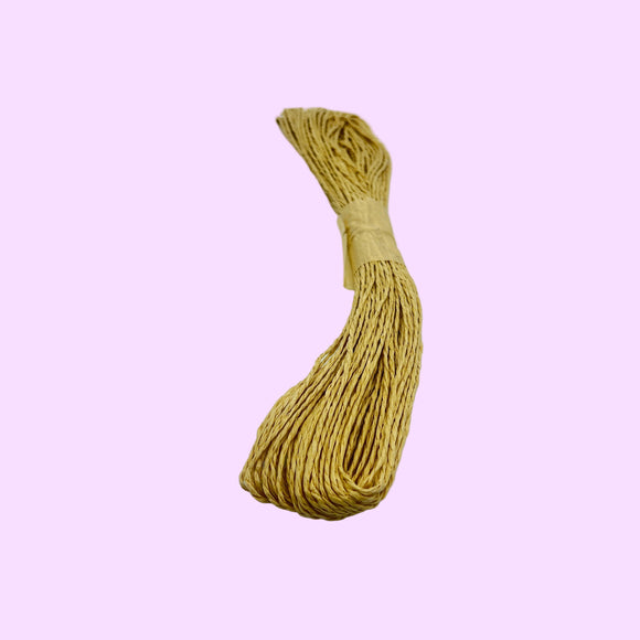 Bundle of beige rope on a white background