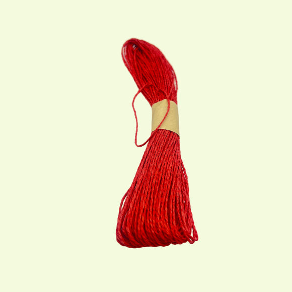 Red yarn on a white background
