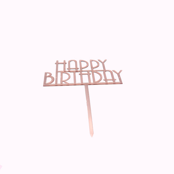 Rose gold 'Happy Birthday' cake topper on a white background