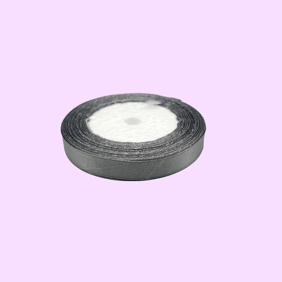 Roll of silver tape on a light gray background