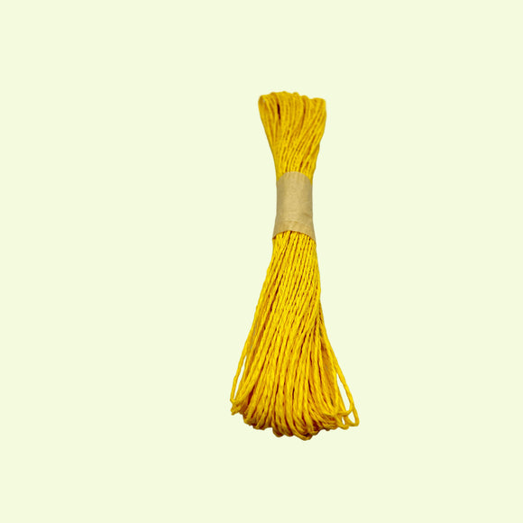 Yellow Raffia bundle on a white background